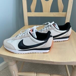 Nike Athletic Shoes in Cream, Black, and white.